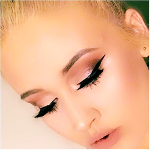 formal makeup look with winged eyeliner and smoky eye