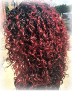 tight curls dyed red