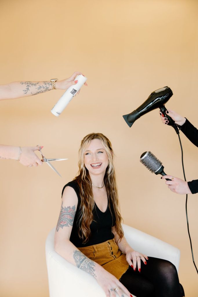 hairstylist with hair tools around her